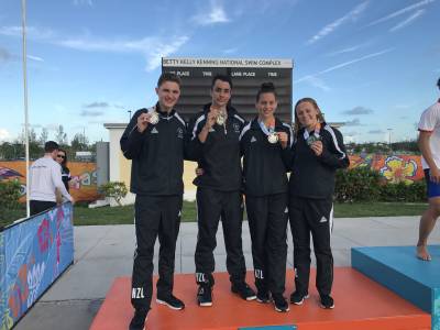 Swimmers end campaign on a high as track and boxing also get amongst the medals